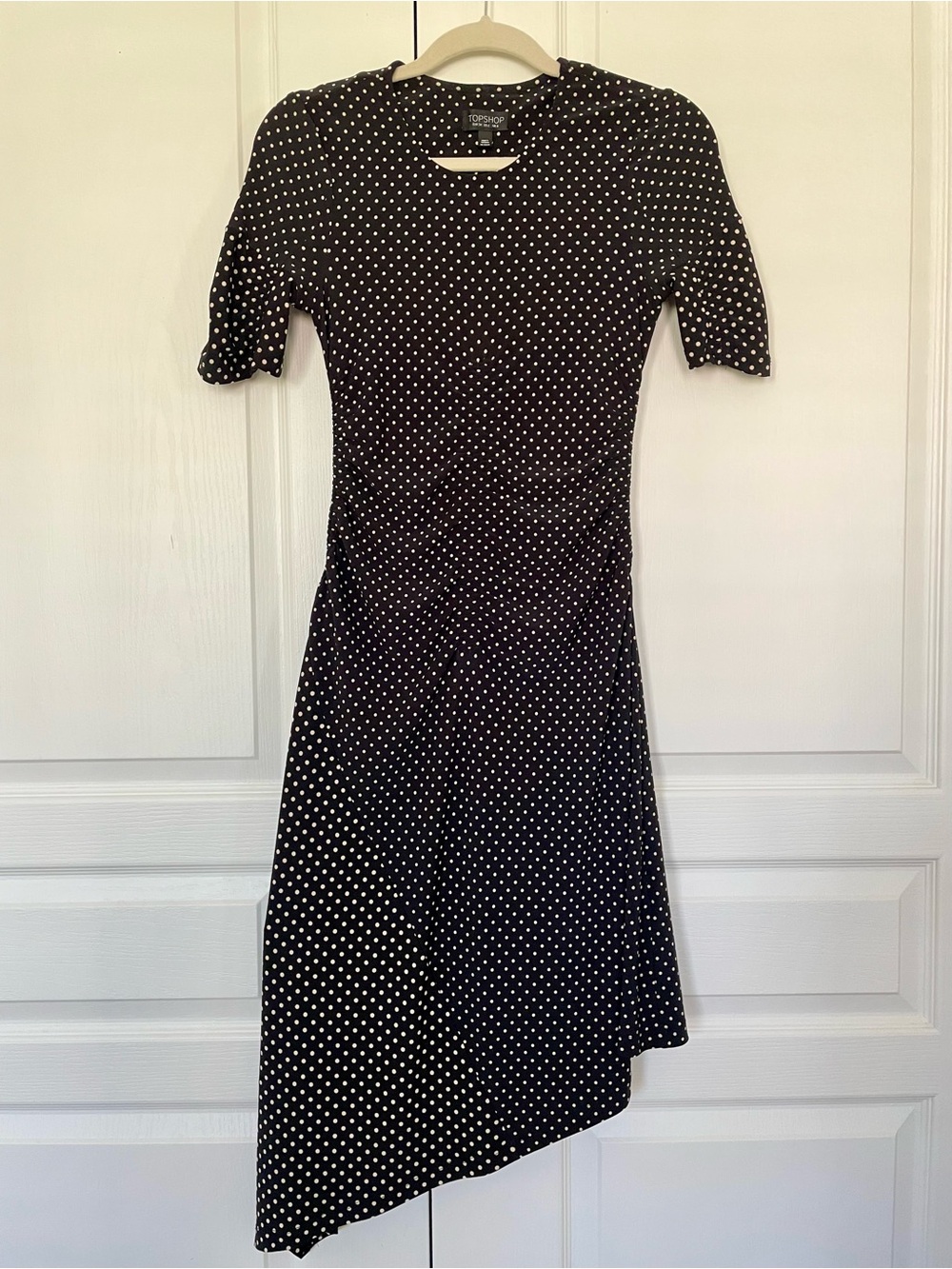Topshop black short-sleeved Topshop polka-dot dress. Size UK 6.